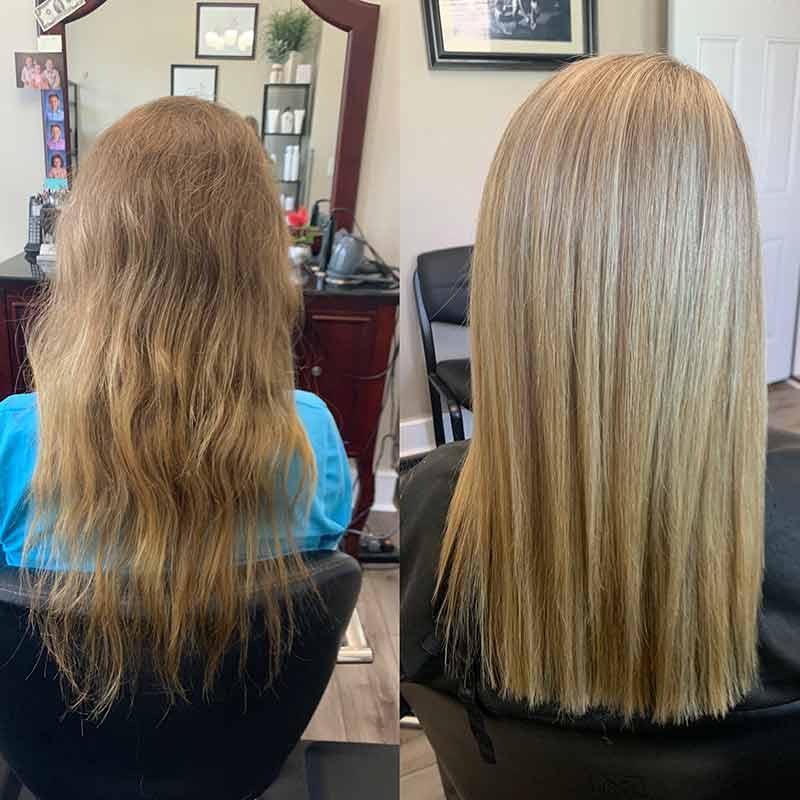 Short silver curly haircut shaped close through the sides with volume on top